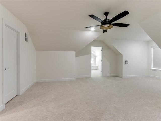 8241 Red Feather, Arcadia, OK 73007 - additional living space with ceiling fan, light carpet, vaulted ceiling, and visible vents