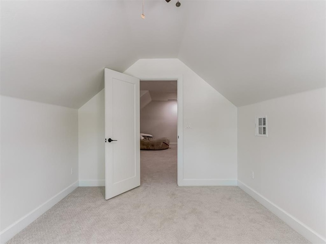 8241 Red Feather, Arcadia, OK 73007 - bonus room featuring light colored carpet, baseboards, visible vents, and vaulted ceiling