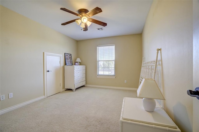 bedroom with light carpet, a ceiling fan, visible vents, and baseboards