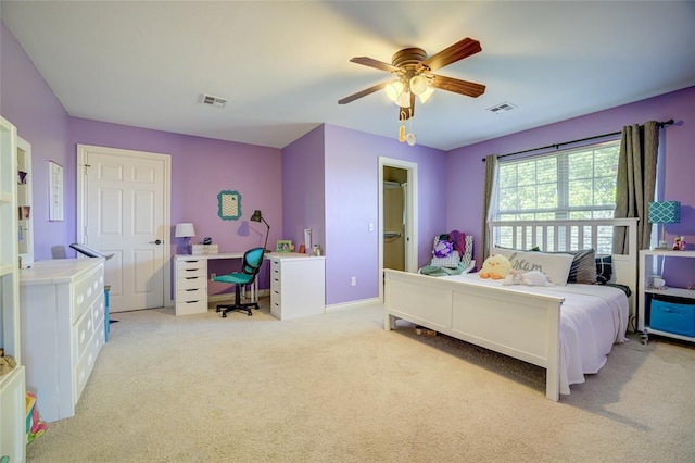 bedroom featuring light colored carpet, ceiling fan, baseboards, and visible vents