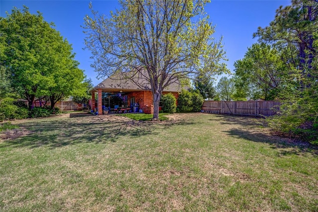 view of yard featuring a fenced backyard and a patio