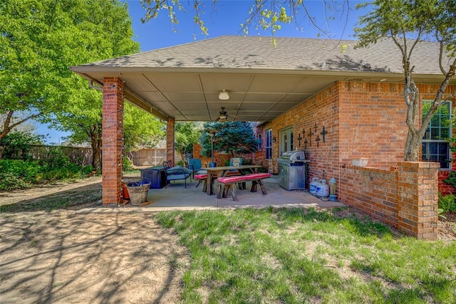 view of patio with a ceiling fan, a fenced backyard, and area for grilling