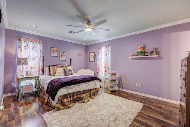 bedroom with visible vents, ornamental molding, and wood finished floors