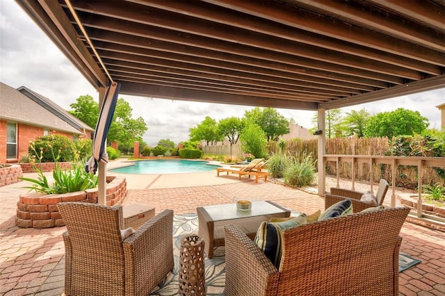view of pool with fence, a fenced in pool, an outdoor living space, and a patio area