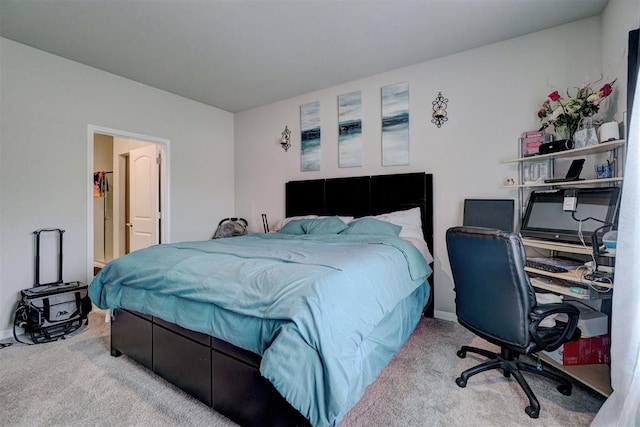 carpeted bedroom with baseboards