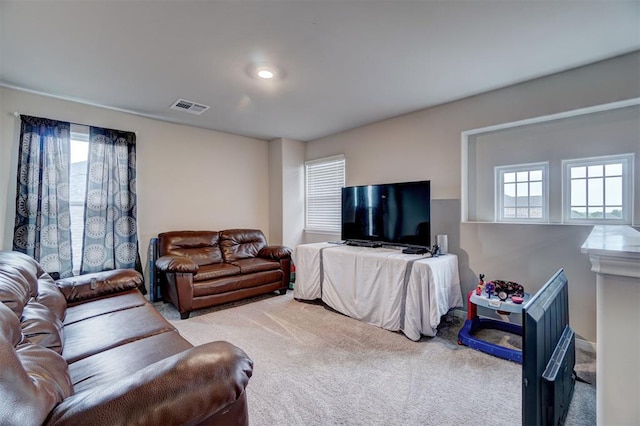 carpeted living room with visible vents