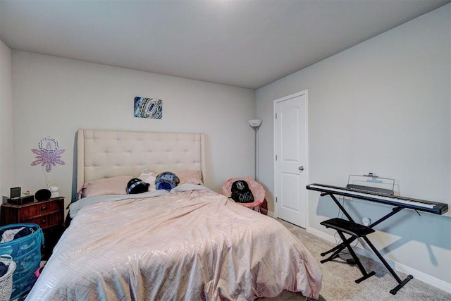 carpeted bedroom with baseboards