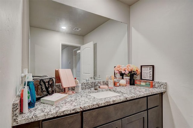bathroom featuring visible vents and vanity