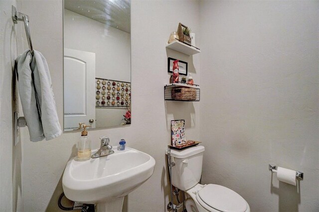 bathroom with a sink and toilet