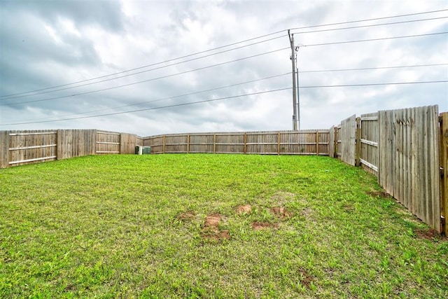 view of yard with a fenced backyard