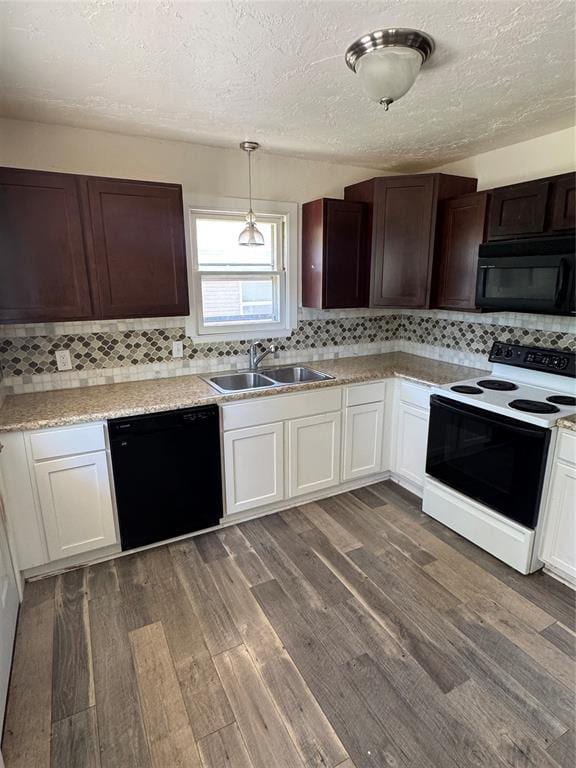 6718 NW 29th St, Bethany, OK 73008 - kitchen with black appliances, dark wood-type flooring, decorative backsplash, a textured ceiling, and light countertops