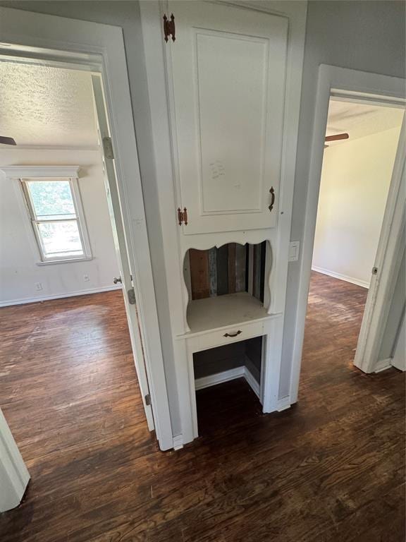 6718 NW 29th St, Bethany, OK 73008 - hallway with dark wood finished floors and baseboards