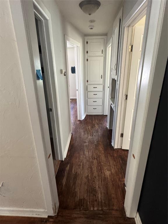6718 NW 29th St, Bethany, OK 73008 - hall with dark wood-type flooring and baseboards