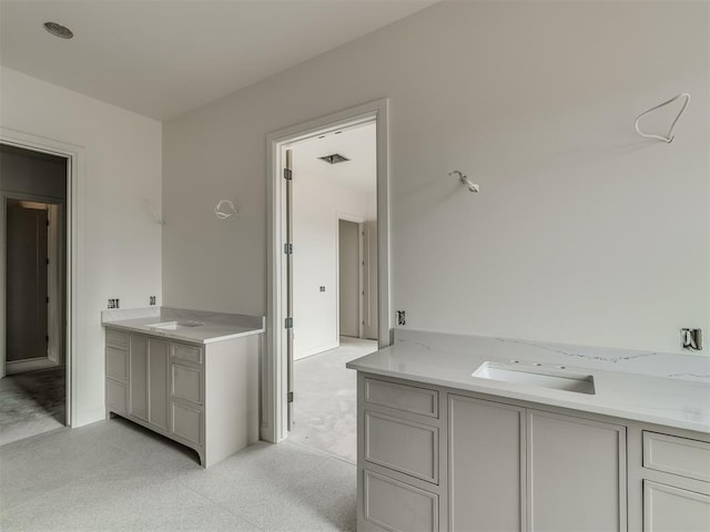 bathroom with tile patterned floors and vanity