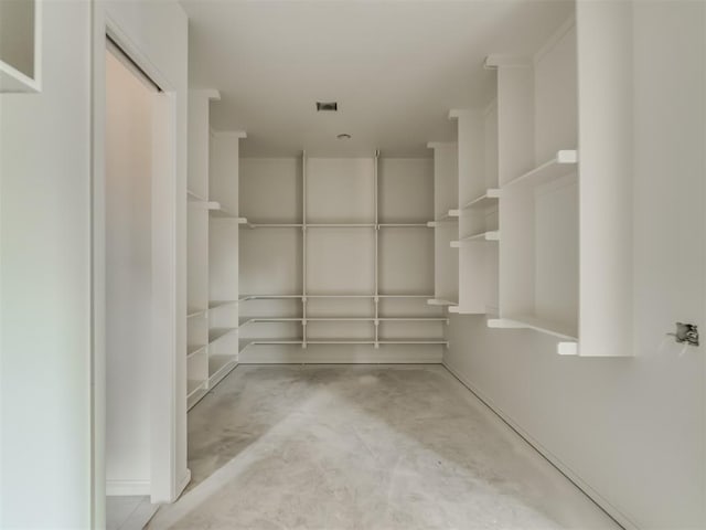 spacious closet featuring visible vents