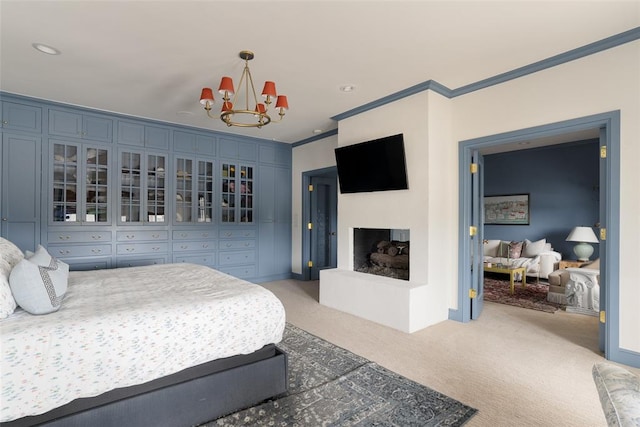 bedroom with light colored carpet, baseboards, crown molding, and an inviting chandelier