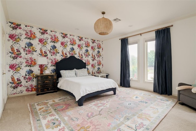 bedroom featuring carpet flooring, baseboards, visible vents, and ornamental molding
