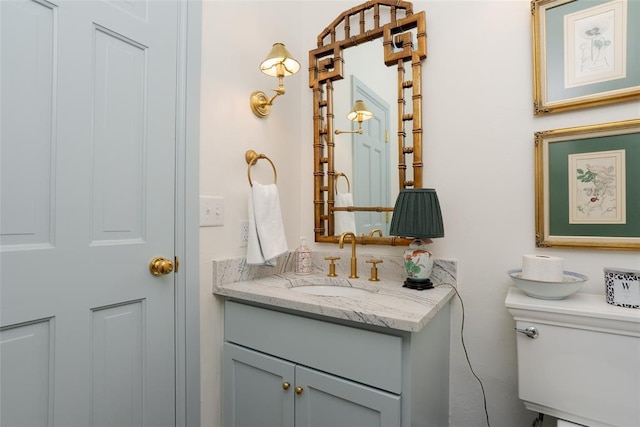 half bathroom featuring vanity