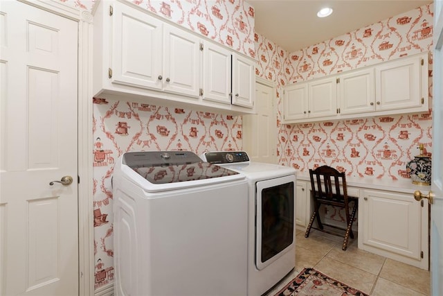 laundry room featuring light tile patterned flooring, wallpapered walls, recessed lighting, separate washer and dryer, and cabinet space