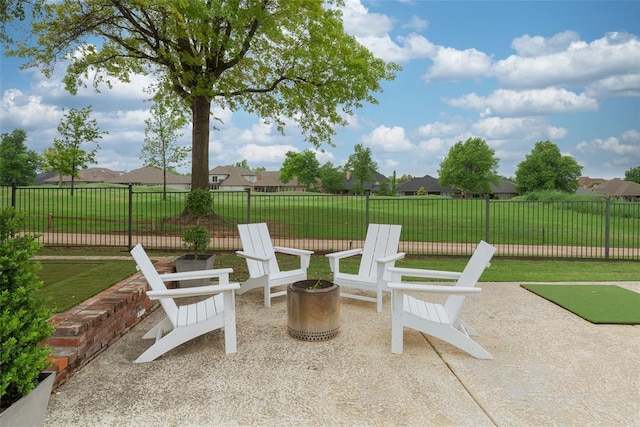 view of patio with fence and a residential view