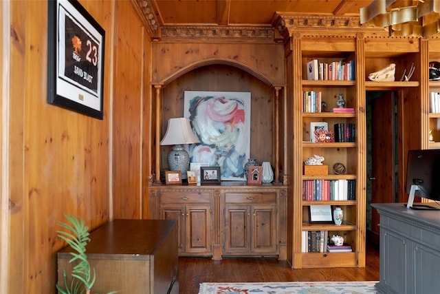 interior details featuring wooden walls and wood finished floors