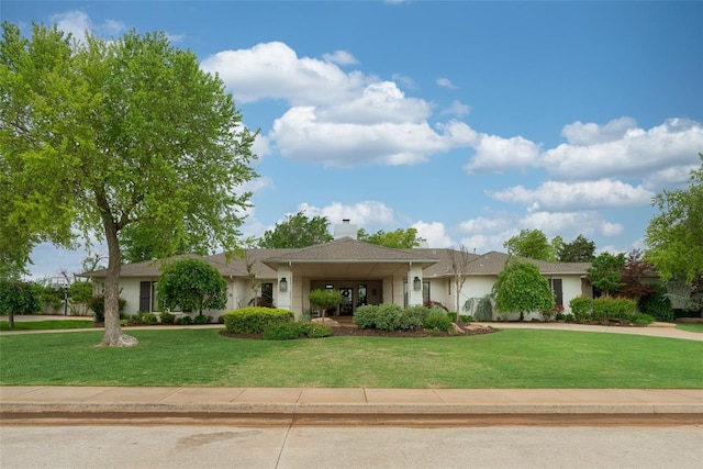ranch-style house with a front yard
