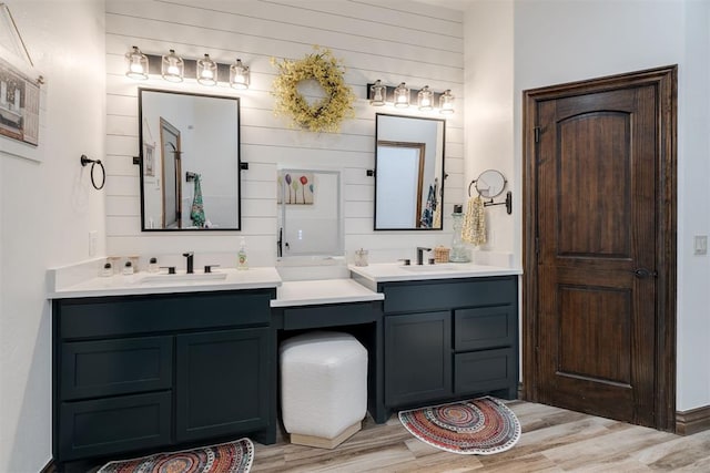 4301 Frisco Bridge Blvd, Edmond, OK 73034 - bathroom featuring wood finished floors, vanity, and wooden walls