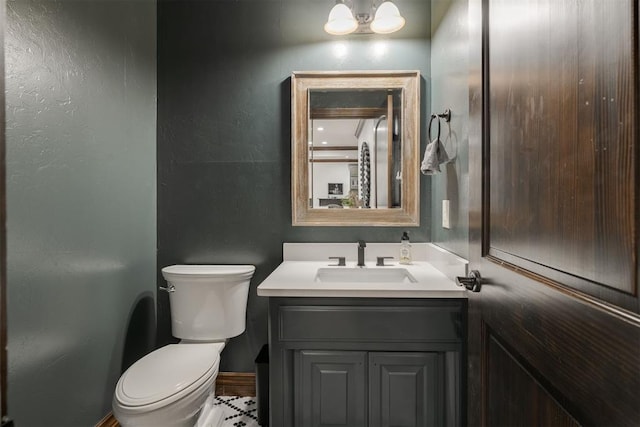 4301 Frisco Bridge Blvd, Edmond, OK 73034 - bathroom with toilet, vanity, a textured wall, and baseboards