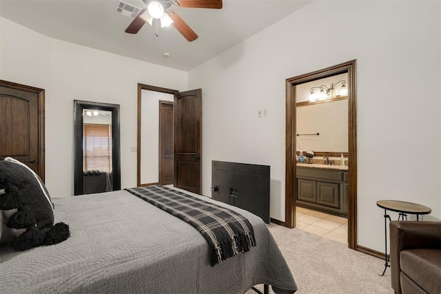 4301 Frisco Bridge Blvd, Edmond, OK 73034 - bedroom with light carpet, connected bathroom, a ceiling fan, baseboards, and light tile patterned floors