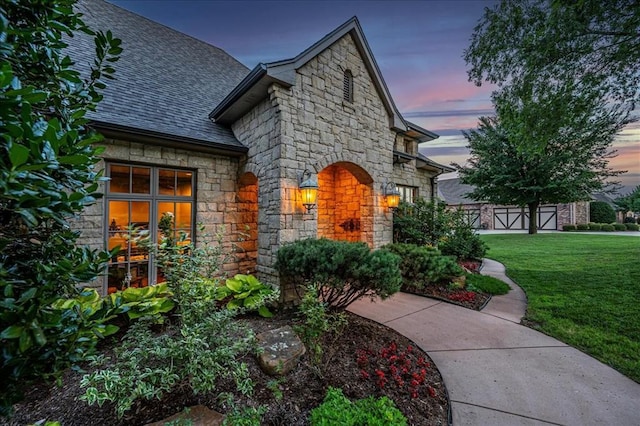 4400 The Ranch Rd, Edmond, OK 73034 - exterior space featuring a lawn, roof with shingles, and stone siding