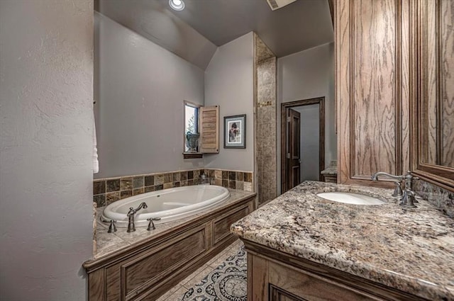 4400 The Ranch Rd, Edmond, OK 73034 - bathroom with a textured wall, tile patterned flooring, a bath, and vanity