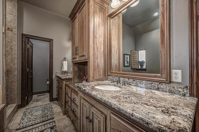 4400 The Ranch Rd, Edmond, OK 73034 - bathroom with vaulted ceiling, vanity, and tile patterned flooring