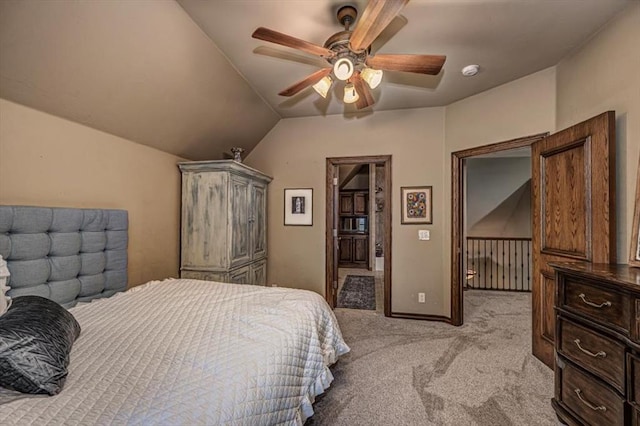 4400 The Ranch Rd, Edmond, OK 73034 - bedroom with a ceiling fan, connected bathroom, lofted ceiling, and light colored carpet