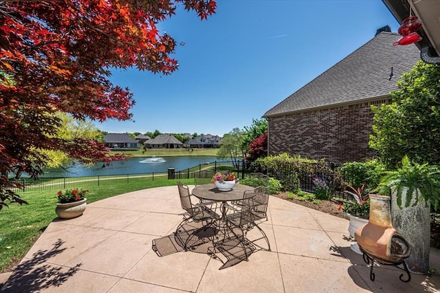 4400 The Ranch Rd, Edmond, OK 73034 - view of patio / terrace featuring outdoor dining space, a water view, and fence
