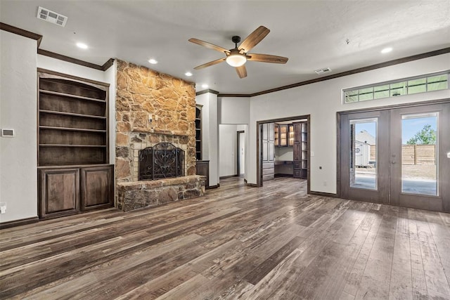 212 SW 144th, Oklahoma City, OK 73170 - unfurnished living room featuring ornamental molding, a ceiling fan, wood finished floors, a fireplace, and french doors