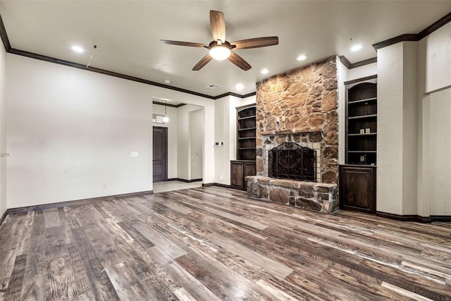 212 SW 144th, Oklahoma City, OK 73170 - unfurnished living room with wood finished floors, ornamental molding, a ceiling fan, a fireplace, and baseboards