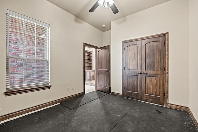 212 SW 144th, Oklahoma City, OK 73170 - unfurnished bedroom featuring baseboards, a closet, multiple windows, and a ceiling fan