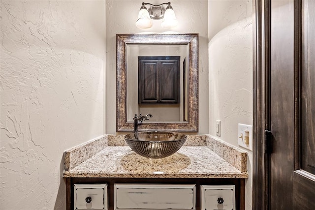 212 SW 144th, Oklahoma City, OK 73170 - bathroom featuring a textured wall and vanity