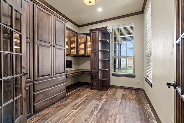 212 SW 144th, Oklahoma City, OK 73170 - unfurnished office featuring built in study area, dark wood finished floors, ornamental molding, healthy amount of natural light, and baseboards