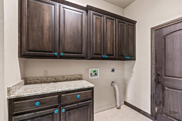 212 SW 144th, Oklahoma City, OK 73170 - laundry room with electric dryer hookup, cabinet space, hookup for a washing machine, light tile patterned flooring, and baseboards