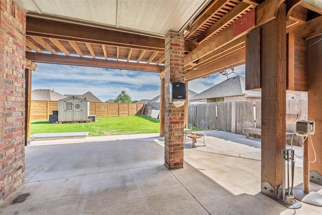 212 SW 144th, Oklahoma City, OK 73170 - view of patio / terrace with a storage shed and an outbuilding