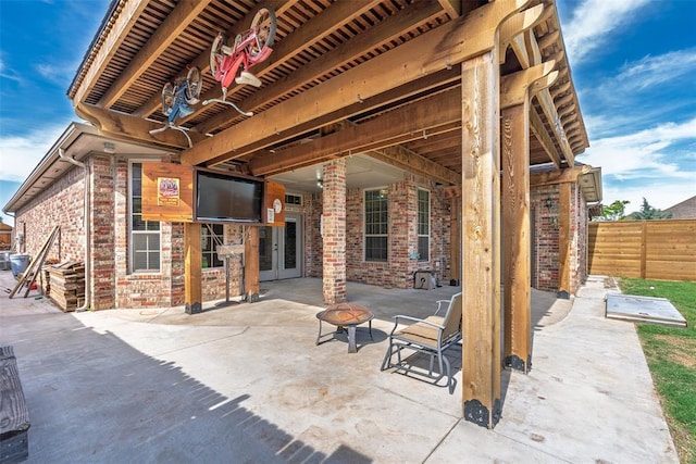 212 SW 144th, Oklahoma City, OK 73170 - view of patio / terrace with fence, an outdoor fire pit, and french doors