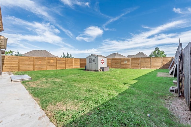 212 SW 144th, Oklahoma City, OK 73170 - view of yard featuring a storage unit and an outbuilding