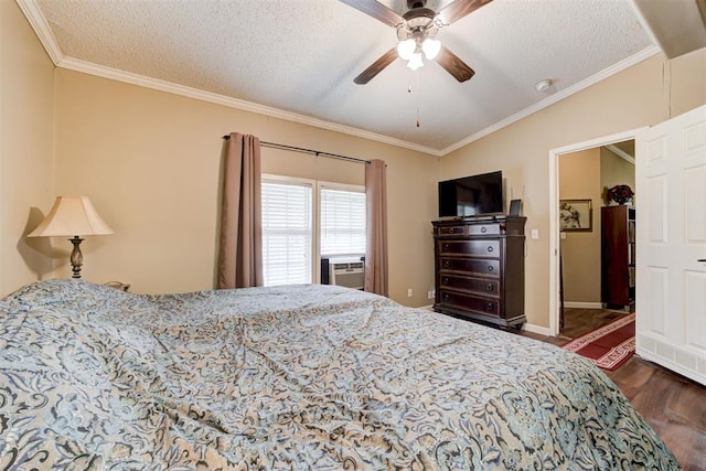 bedroom featuring crown molding, a textured ceiling, and wood finished floors