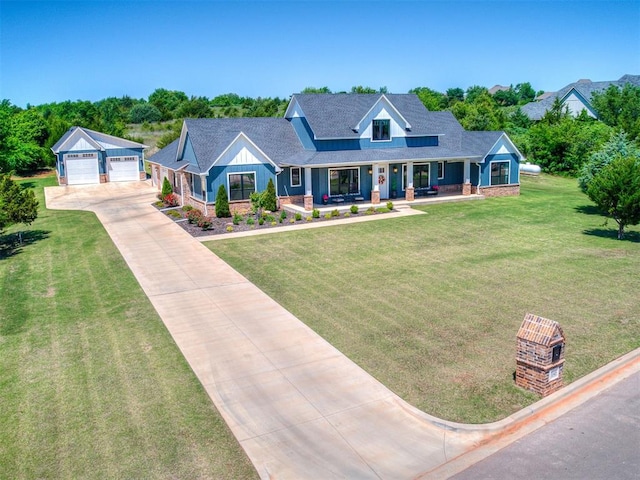3345 Red Ridge Dr, Blanchard, OK 73010 - view of front facade featuring covered porch, a garage, a front lawn, a shingled roof, and board and batten siding