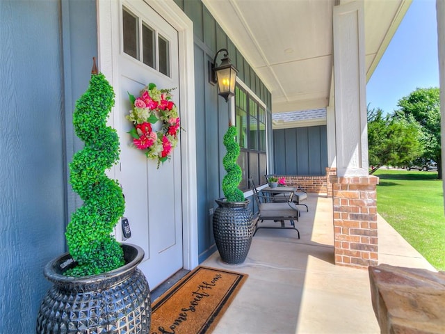 3345 Red Ridge Dr, Blanchard, OK 73010 - entrance to property with covered porch and board and batten siding