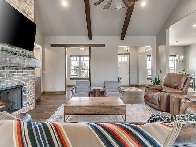 3345 Red Ridge Dr, Blanchard, OK 73010 - living area featuring baseboards, a brick fireplace, wood finished floors, and a ceiling fan
