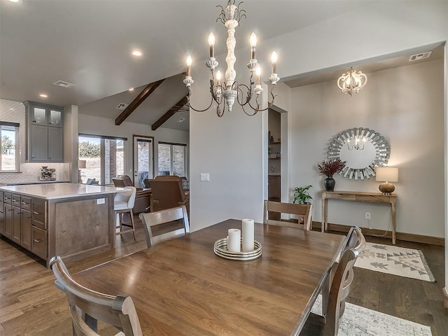 3345 Red Ridge Dr, Blanchard, OK 73010 - dining area with a chandelier, wood finished floors, vaulted ceiling, and recessed lighting