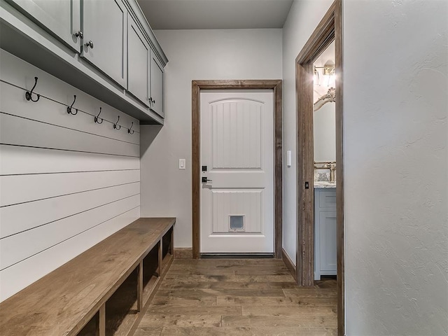 3345 Red Ridge Dr, Blanchard, OK 73010 - mudroom featuring wood finished floors and baseboards