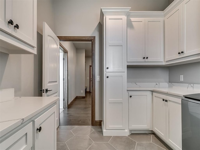 3345 Red Ridge Dr, Blanchard, OK 73010 - kitchen featuring white cabinets, light tile patterned flooring, stove, and baseboards